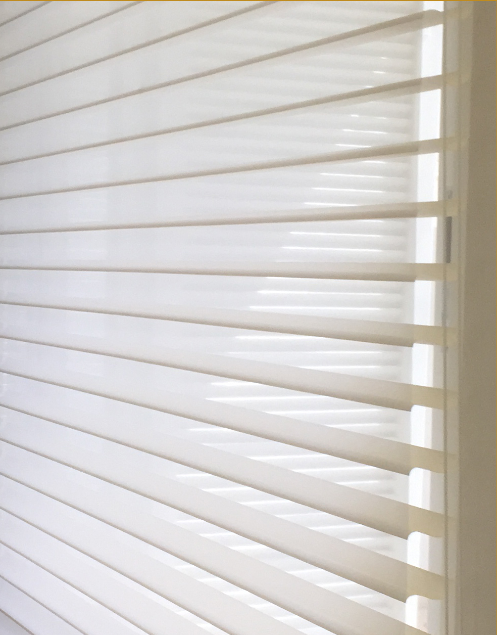 Close-up of white sheer shades